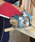 Heavy Duty 4 Inch Woodworking Belt Sander Dust Collection Bag With Reusable Debris Catcher And No Hassle Quick Snap Mount attached to a saw.