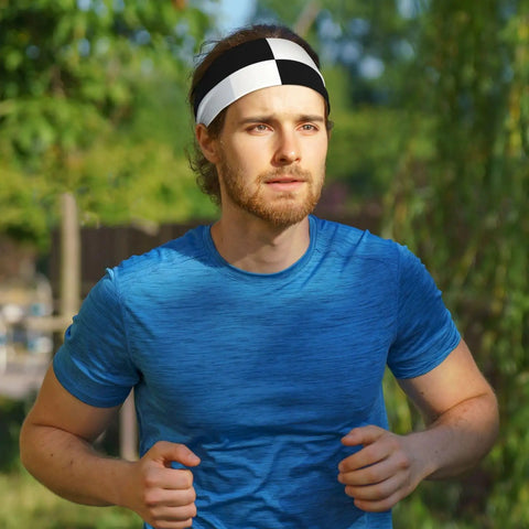 Black And White Piano Grid Print Stretchy Headbands Sweat Wicking And Ultra Breathable Workout Band on a man jogging outdoors.