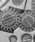 Close-up of Stainless Steel M4 X 12mm Beefy Slotted External Thread Dowel Pins 15 Piece Set in gears view