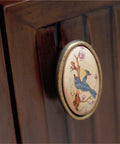 4 Pack Ceramic Cabinet Knob Pulls Set For Cabinets And Dressers, featuring bird design on metal handle on wooden cabinet