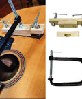 Easy Use Acoustic Guitar Bridge Install Clamp Kit For Folk Guitars, Glue And Seam Repair Tool in use, metal and wood parts visible