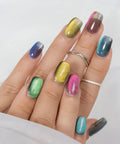 Mystic Galaxy 9D Cat Eye Gel Nail Polish Set, multicolored holographic nail design with magnetic light play on hands