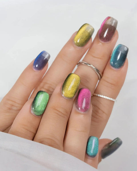 Mystic Galaxy 9D Cat Eye Gel Nail Polish Set, multicolored holographic nail design with magnetic light play on hands