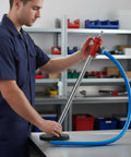 Beast Drill Powered Spiral Oil Transfer Pump With Reversible Bidirectional Action Liquid Extractor Auxiliary Handle Ideal For Workshop Automotive Service And Maintenance 1M Hose, man using red metal pump with blue hose