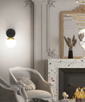 Black And Gold Globe Wall Sconce Mid Century Modern One Light Fixture for Living Room highlighting elegant decor.