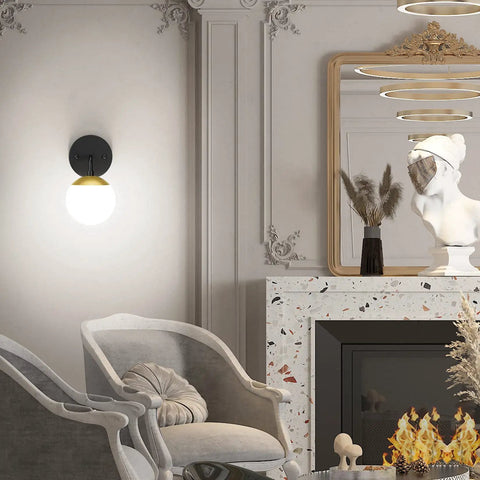 Black And Gold Globe Wall Sconce Mid Century Modern One Light Fixture for Living Room highlighting elegant decor.