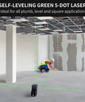 5 Point Green Laser Level With Self Leveling Dots And Magnetic Base, Plumb Up And Down Beams, 131 Foot Range, Includes 2 AA Batteries And Pouch, Pro Grade DIY Favorite For Quick, Accurate Layouts From Floor To Ceiling, shown projecting green dots in an unfinished room