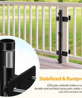 Close-up of black steel Rugged Deck Railing Umbrella Holder Mount for Patio with adjustable clamp attached to white rail.
