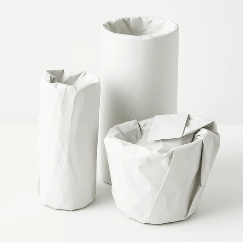 Items wrapped in 13 By 12 Inch White Packing Paper Sheets, 100 Count, for protecting fragile glassware and mugs during shipping.