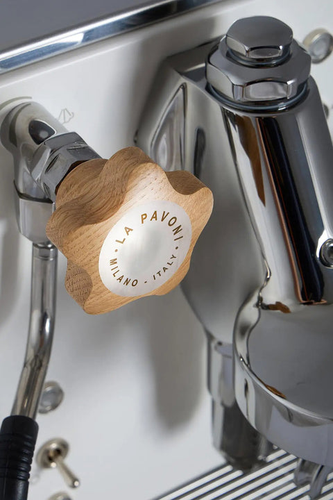 Mini Cellini Espresso Machine With Steam Wand And Pressure Gauge, white paneling, chrome accents, wooden handle, close-up view