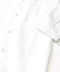 Unisex Knot Button Lab Coat Blazer In White X Small, Five Button Closure, Two Lower Pockets And One Chest Pocket, Professional Medical Uniform With Durable Fabric And Comfortable Fit For Daily Shift Work, sleeve and pockets detail