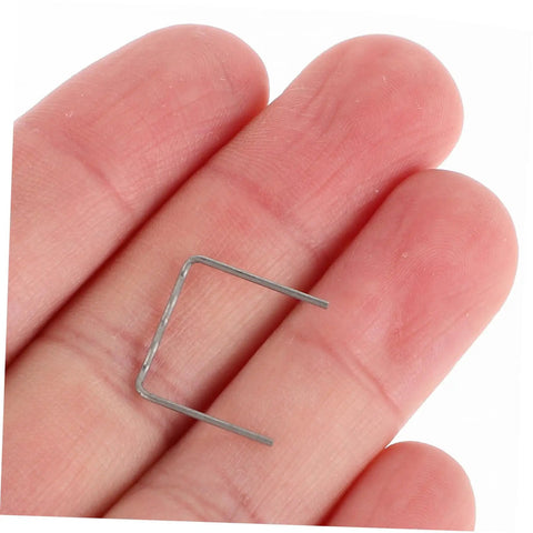 Hand holding a single pre-cut wave staple from Hot Staple Repair Rods 100pcs For Automotive Bumper Repair Pre Cut Wave Staples Quick Fix