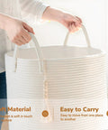 Person holding White Laundry Basket With Handles, Tall Woven Hamper For Clothes And Towels, Holds A Week Of Laundry, 16 By 20 Inches