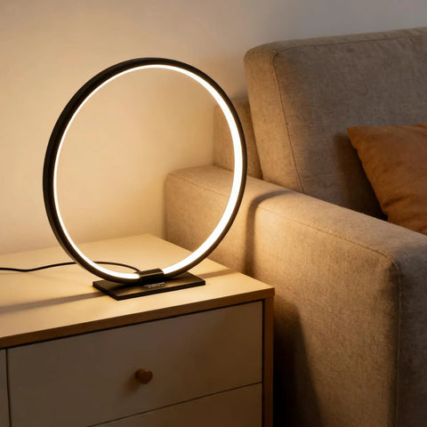 Open Circle LED Table Lamp With Dimmable Touch Control And Warm 3000K Light in Black on nightstand in bedroom, modern minimalist design