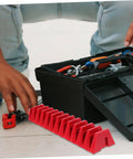 Modular Wrench Rack Organizer 12-Piece Space Saving Tool Storage Tray in red, next to a toolbox, on workshop floor.