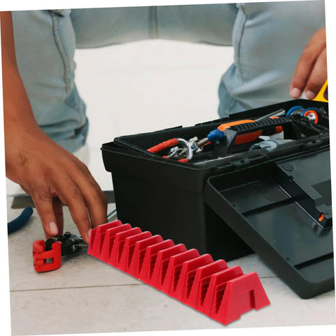 Modular Wrench Rack Organizer 12-Piece Space Saving Tool Storage Tray in red, next to a toolbox, on workshop floor.