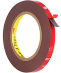 3M VHB double-sided foam mounting tape roll with brown foam core and red release liner