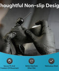 Nitrile gloves on hands, black disposable XL, front view handling a textured Velcro strap