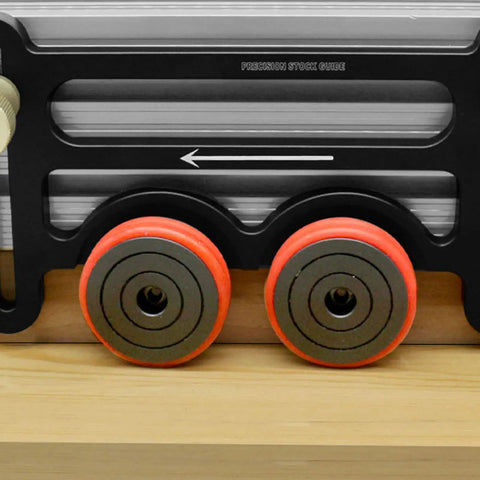 Dual Wheel Rolling Feed Guides For Table Saw And Router Table Built Like A Tank With Rust Proof Anodized Aluminum Double Bearing Wheels on a wooden surface.