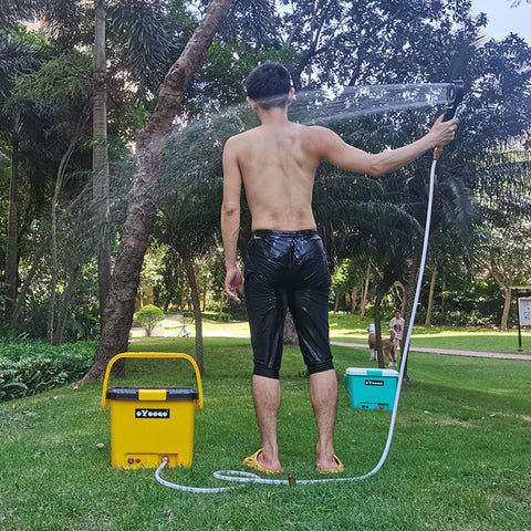 Person using Compact Portable Pressure Washer With 5 Gallon Tank And 255 Psi For Easy Car Washes Pet Bath Home And Patio Cleaning Plus A Camper Friendly 45 Minute Runtime For Off Grid Adventures outdoors