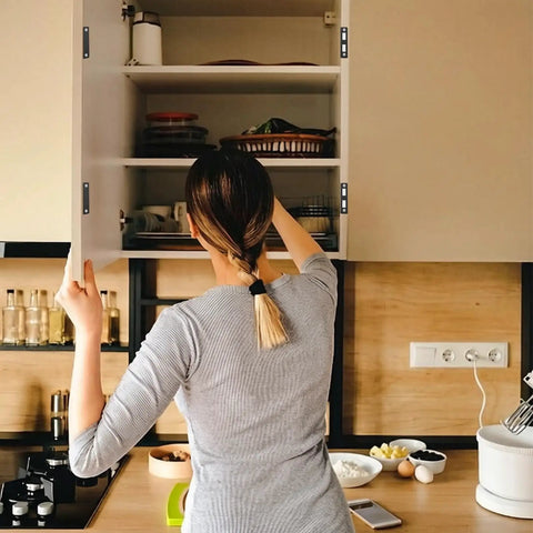 Person using kitchen cabinet with Hidden Slim Cabinet Latch With Ultra Thin Stainless Steel Hardware, Heavy Duty Magnetic Hold.