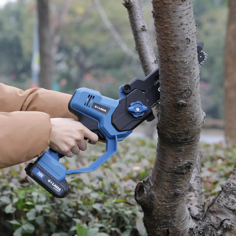 Person using 8 Inch Cordless Mini Chainsaw With Dual 2000mAh Batteries Electric Handheld Tree Trimmer for yard work on tree branch