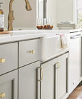 Kitchen with Champagne Bronze Revitalize Cabinet Pull 5-1/16 Inch Center to Center Drawer Pulls on gray cabinetry