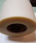 End view of 6 Inch Wide Urethane Die Protection Film Roll, 0.015 Inch Thick, 100 Foot Long For Press Brake Applications on table