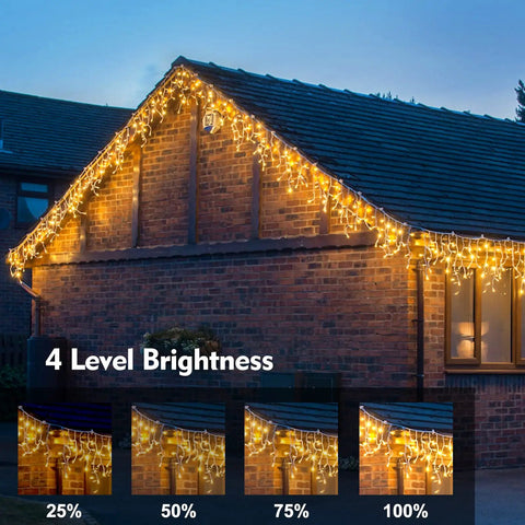 Outdoor Icicle Christmas Lights With 1008 LEDs, 98.4 Ft Warm White Drops on house eaves at night, 4 level brightness shown