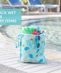 Super Handy Waterproof Wet Bag Two Pack For Travel And Beach with poolside scene, holding a towel and goggles, ocean colors.