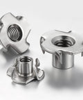 Three 1/4-20 304 stainless steel four-jaw T-nuts with threaded holes for wood inserts.
