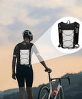 Cyclist wearing Go To Hydration Vest For Runners And Hikers With Breathable Mesh, Lightweight Pack, adjustable straps, sunset backdrop