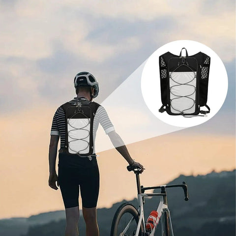 Cyclist wearing Go To Hydration Vest For Runners And Hikers With Breathable Mesh, Lightweight Pack, adjustable straps, sunset backdrop