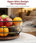 Smooth Spinning 360 Degree Rotating Fruit Bowl With Hefty Capacity Deep Basket And Solid Banana Stand For Kitchen Counter Organization And Absolutely Slick Everyday Utility showcasing fruits in an open-wire design.