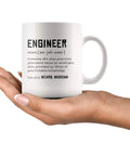 Engineer Definition Funny Gift Mug For Engineering Students Teachers And Pros Nerdy Computer Civil Mechanical Electrical Software Engineers 11 Oz White Ceramic Coffee Mug held in hand