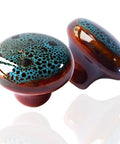 Two Vintage Blue Glazed Ceramic Cabinet Knobs with smooth glaze finish, classic retro look, durable ceramic construction, image focus