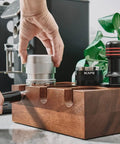 Barista using 53mm Espresso Tamper Premium Barista Calibrated Spring Loaded One Hundred Percent Stainless Steel Coffee Tamper