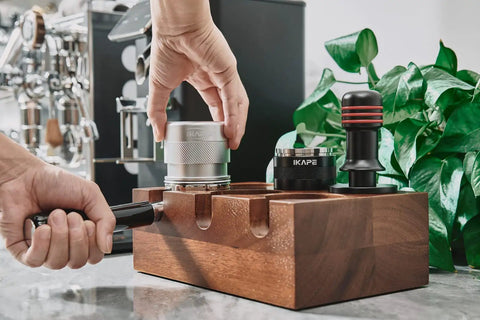 Barista using 53mm Espresso Tamper Premium Barista Calibrated Spring Loaded One Hundred Percent Stainless Steel Coffee Tamper