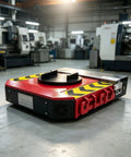 Heavy Duty Electric Moving Skates For Up To Forty Tons, industrial transport platform, red and black design in factory setting.