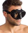 Man wearing Nano 2-Lens Dive Mask For Scuba And Freediving, ultra low-profile hydrodynamic design, black on black silicone build.