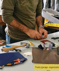 Heavy Duty Canvas Tool Bag Organizer Set Of 7 Pouches in assorted colors on a workbench with tools and gear