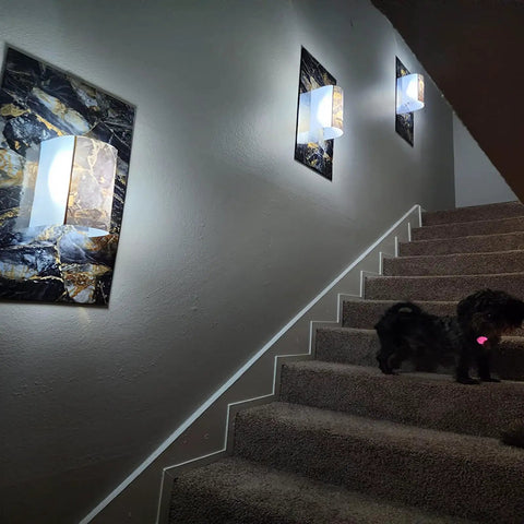 Staircase with wall lights and dog, showcasing Black Marble Peel And Stick Contact Paper 16 Inch By 118 Inch Self Adhesive Wallpaper.