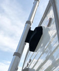 Rugged RV Ladder Bracket With Snap Fit Mount For On-The-Go Ladder System attached to exterior of camper