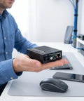 Person holding a Snag This Gigabit Fiber Optical Media Converter For Serious Speed Up To 3Km With Auto Negotiation On 10 100 1000Mbps And Smooth Single Mode SC Upto Connections That Totally Smash Network Lag.