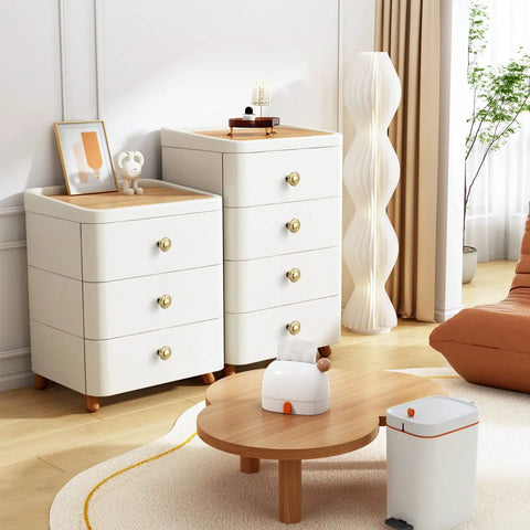 Five Pack Slick Polished Brass Cabinet Knobs 1.23 Inch Round Gold Drawer Pulls on white dressers in modern room
