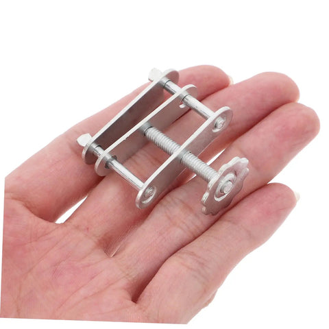Close-up of a single metal tubing clamp from the Twenty Pack Spring Water Stop Clip Tubing Clamps For Lab Flow Control And Leakproof Pro Grade Scientific Experiments Ideal For Research And Teaching Labs Medical And Industrial Applications.