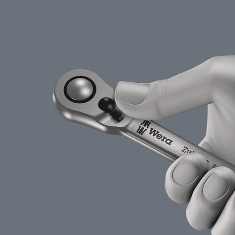 Zyklop Metal Ratchet With Switch Lever and One Quarter Inch Drive held by hand, showing ultra slim handle, long lever, 5 degree return.