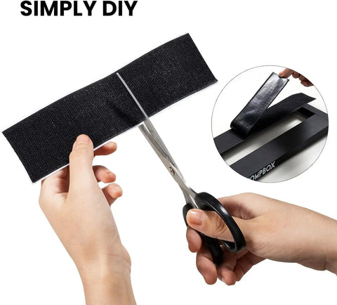 Person cutting Guitar Pedalboard Velcro Mounting Tape 2m Long By 5cm Wide For Securing Effects Pedals with scissors