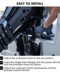 Side view of outboard motor transom saver with a single ram wedge; black metal bracket mounted to boat transom