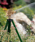 Beefed Up Heavy Duty Zinc Tripod Impact Sprinkler With 360 Degree Rotation And Adjustable Height High Pressure Nozzle in garden